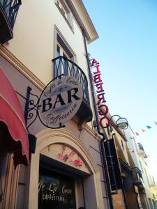 a bar sign on the side of a building at Albergo Residenziale La Corte in Tortolì