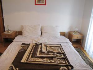 Postel nebo postele na pokoji v ubytování Guesthouse Rupčič