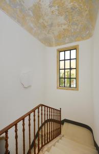 Letto o letti in una camera di Palazzo De Noha - Boutique Hotel