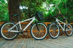 two bikes parked next to each other on a wooden deck at Hotel Las Islas in Barú