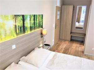 Postel nebo postele na pokoji v ubytování Hotel Scheid