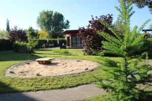 a park with a bench in the middle of a yard at Ferienoase in Pirna