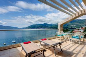 a balcony with a view of the water at Apartments Villa Adriatic in Tivat
