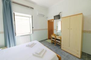 Postel nebo postele na pokoji v ubytování Albergo Marla