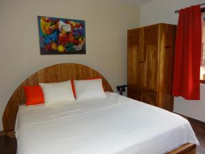 Rúm í herbergi á Hotel-Boutique Patampa