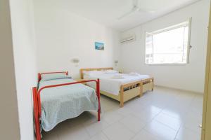 Postel nebo postele na pokoji v ubytování Albergo Marla