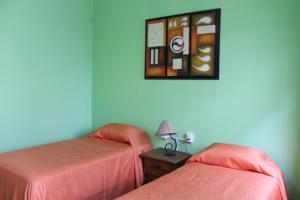 Rúm í herbergi á Hostal don Felipe