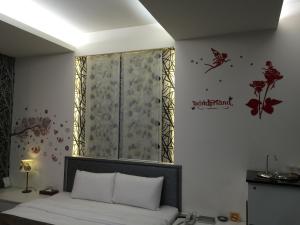 Yuan Chyau Motel tesisinde bir odada yatak veya yataklar