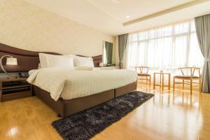 Postel nebo postele na pokoji v ubytování Avada Hotel