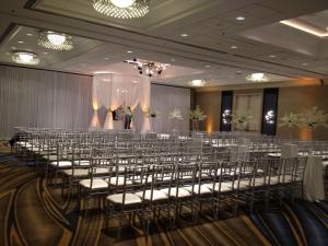 a banquet hall with rows of chairs and a stage at Hyatt Centric Chicago Magnificent Mile in Chicago