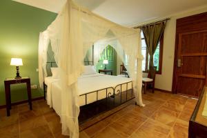 Un ou plusieurs lits dans un hébergement de l'établissement Mediterraneo Boutique Hotel
