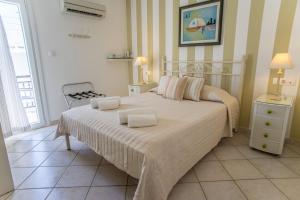 Postel nebo postele na pokoji v ubytování Hotel Cyclades