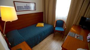 Postel nebo postele na pokoji v ubytování Classic Hotel Tulipano + 37 fotografií