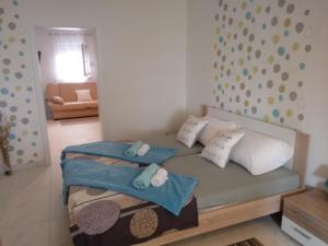 Postel nebo postele na pokoji v ubytování Apartmani Fran Vir