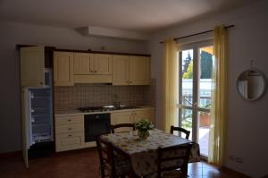 a kitchen with a table with a table cloth on it at Agriturismo Tendapiccola in Ceriale
