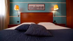 Krevet ili kreveti u jedinici u objektu Classic Hotel Tulipano