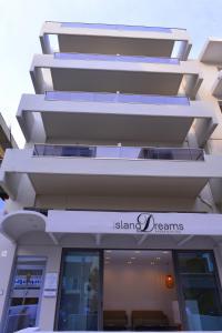 a building with the name island dreams on it at Island Dreams Rooms & Suites in Rhodes Town