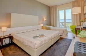 Postel nebo postele na pokoji v ubytování Hotel Miramar + 37 fotografií