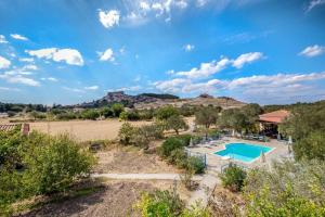 an aerial view of a swimming pool in the middle of a field at Diamanti Molivos Studios & Apartments in Mythimna