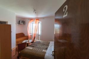 Postel nebo postele na pokoji v ubytování Guesthouse Storelli