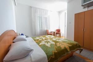 Postel nebo postele na pokoji v ubytování Guesthouse Storelli
