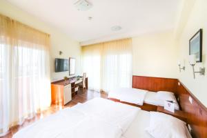 TV a/nebo společenská místnost v ubytování Hotel Merlot