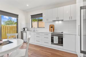 A kitchen or kitchenette at Rosewater Townhouses Dromana