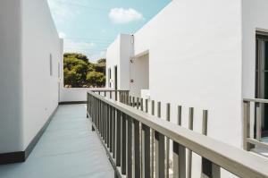 an empty corridor of a building with white walls at Sandom in Parikia
