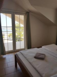Ένα ή περισσότερα κρεβάτια σε δωμάτιο στο Apartments Palaca Sunca