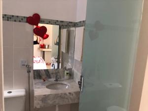 a bathroom with a sink and a mirror at Pousada Xero in Capitólio +113 photos