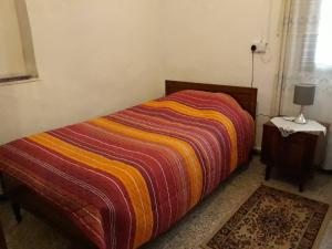 מיטה או מיטות בחדר ב-Christos House