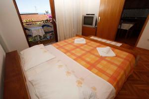 Postel nebo postele na pokoji v ubytování Villa Grozdic