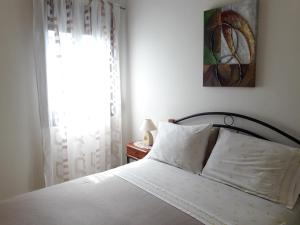 Postel nebo postele na pokoji v ubytování Sdregas Flats