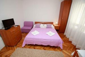 Postel nebo postele na pokoji v ubytování Villa Grozdic