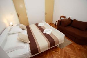 Postel nebo postele na pokoji v ubytování Villa Grozdic