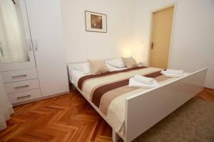 Postel nebo postele na pokoji v ubytování Villa Grozdic