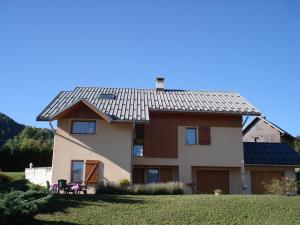 a house with a metal roof on top of it at Chambre d'hôtes - La Maurillonnette in Saint-Pancrace