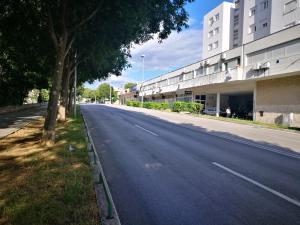 an empty street in front of a building at Apartman Doris in Split