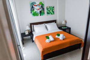 a bedroom with a bed with two stuffed animals on it at Sea Breeze Flat in Kavála