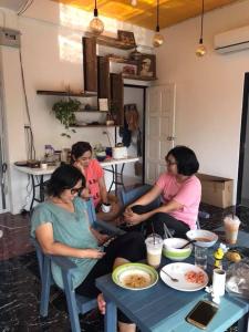 a group of women sitting around a table at Baan Bon Resort Bang Tabun in Phetchaburi