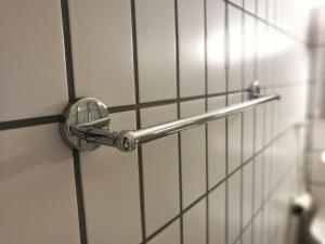 a chrome door handle on a white wall at Sealounge 239 in Ueckermünde