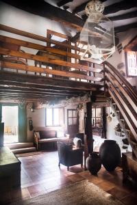 a large living room with a staircase and a couch at Molino del Feo in Las Casas Altas