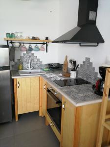 a kitchen with a sink and a stove at Christou Homes in Steni Vala Alonissos +17 photos