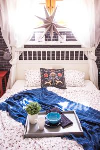 מיטה או מיטות בחדר ב-Apartament PREMIUM Inga