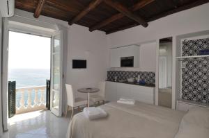 A bed or beds in a room at Stella Marina Amalfi Dreams