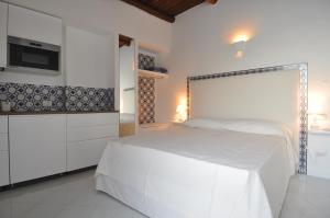 A bed or beds in a room at Stella Marina Amalfi Dreams
