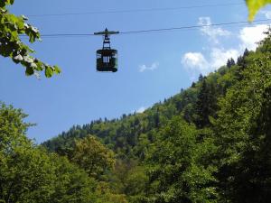 a ski lift in the air over a mountain at Nunisi Forest Hotel & SPA in Nunisi