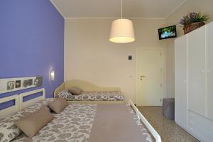 A bed or beds in a room at Hotel Roma