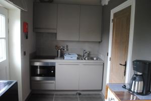 Kuchyň nebo kuchyňský kout v ubytování Vakantiewoning 't Blooteland
