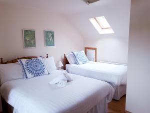 Кровать или кровати в номере Dunlewey Lodge - Self Catering Donegal